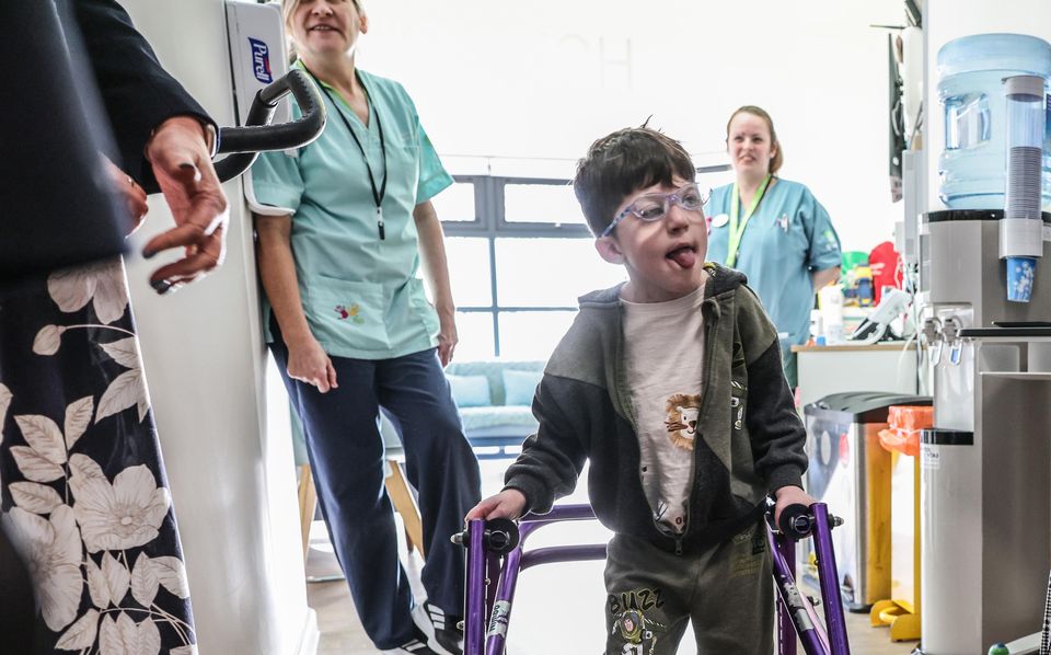 The Princess of Wales speaks to five-year-old Oscar, during a visit to the hospice in Sully, near Cardiff (Richard Pohle/The Times/PA)