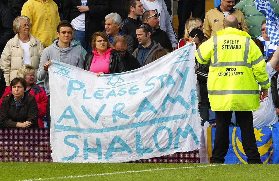 Portsmouth fans held up a sign asking Avram Grant to remain Portsmouth manager following the club’s relegation from the Premier League (Chris Ison/PA)