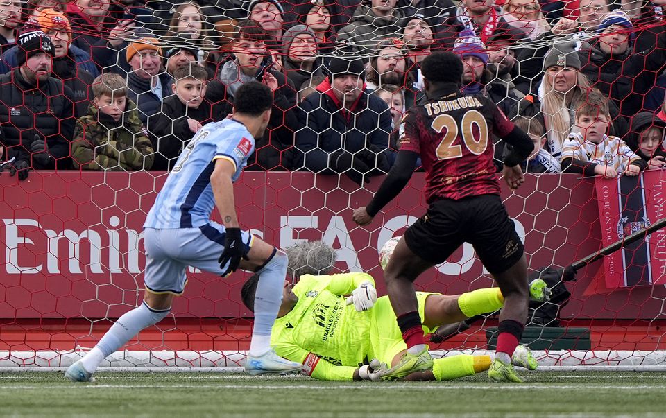 Tamworth’s Nathan Tshikuna (right) scored an own goal against Tottenham (Joe Giddens/PA)