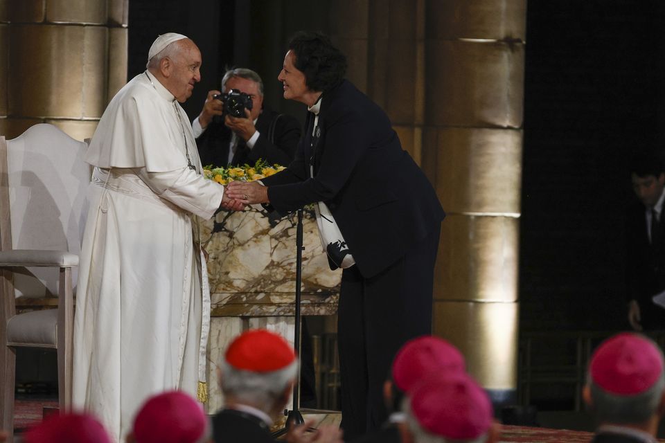 Pope Francis is greeted by Mia De Schamphelaere (Omar Havana/AP)