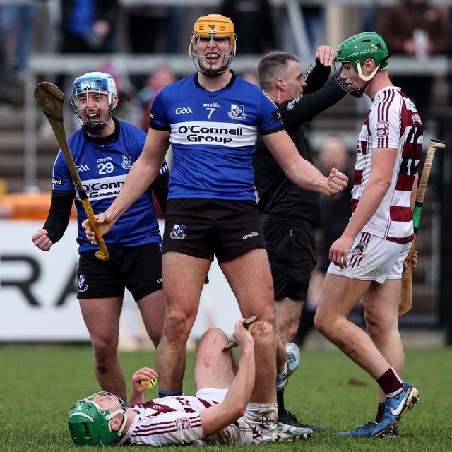 Sarsfields' Liam Healy and Luke Elliott celebrate following their side's victory over Slaughtneil