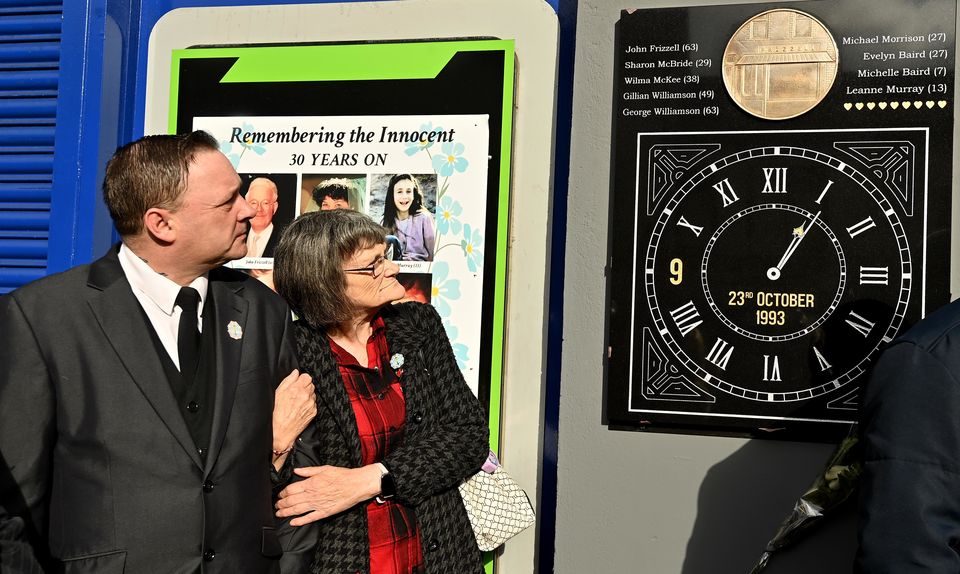 Gary Murray and Gina Murray during the unveiling and dedication on the Shankill Road in Belfast of the new memorial before a service to mark the 30th anniversary of the Shankill bomb in 2023 (Oliver McVeigh/PA)