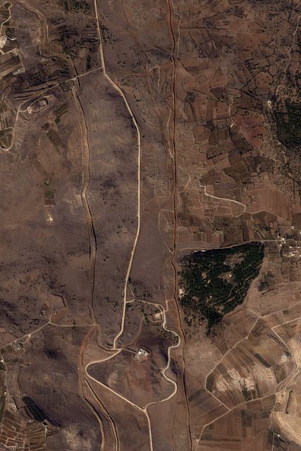 A satellite image showing Israeli work along the Alpha Line separating the Israeli-occupied Golan Heights from a demilitarised zone in Syria patrolled by UN forces (Planet Labs PBC/AP)