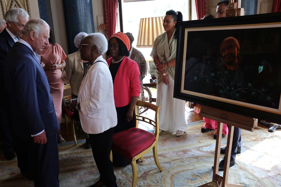 The King with Carmen Esme Munroe during a reception at Buckingham Palace in London, to mark the 75th anniversary of the arrival of HMT Empire Windrush to Tilbury Docks in Essex, on June 22 1948 (Chris Jackson/PA)