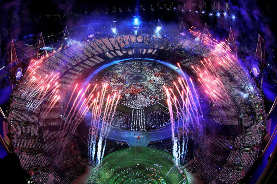 Fireworks light up over the stadium during the Opening Ceremony at the 2012 Summer Olympics, Saturday, July 28, 2012, in London. (AP Photo/David J. Phillip)