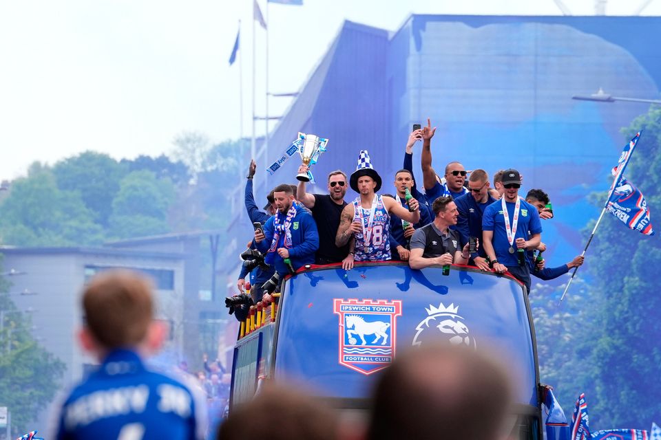 Ipswich Town players during an open-top bus parade in Ipswich to celebrate promotion to the Premier League. Pic: Gareth Fuller