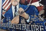 thumbnail: A mural on the Falls Road in west Belfast ahead of the visit of US President George Bush to the Stormont Castle in Belfast