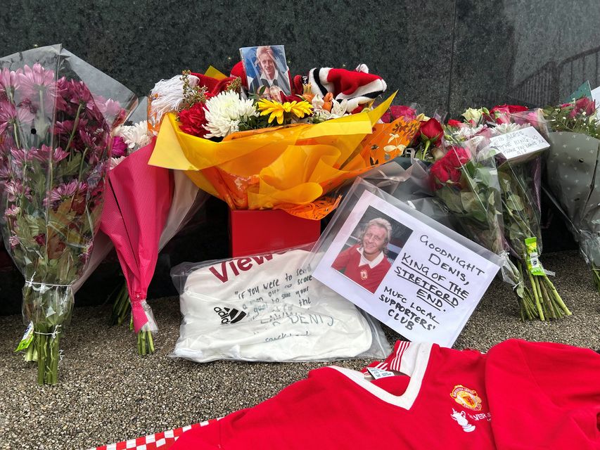 Tributes outside Old Trafford in memory of Denis Law (Martin Rickett/PA)