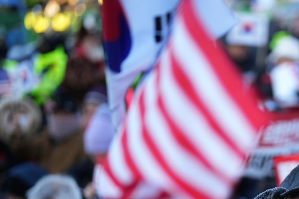 Supporters of impeached South Korean President Yoon Suk Yeol stage a rally to oppose a court warrant for his arrest (Lee Jin-man/AP)