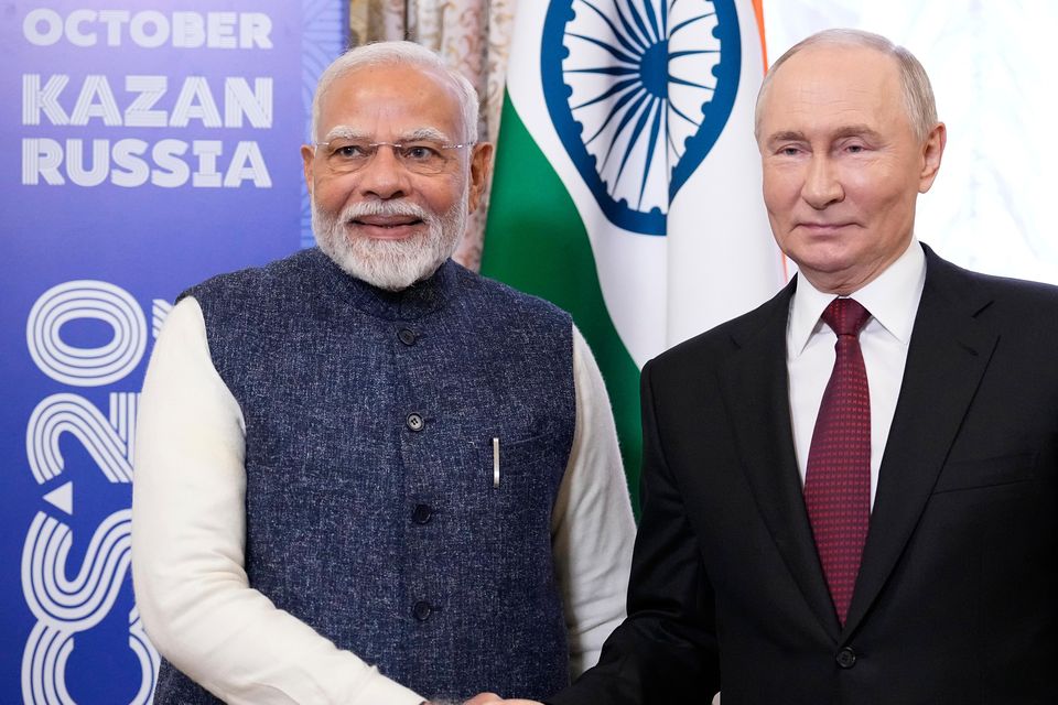 Russian president Vladimir Putin and Indian leader Narendra Modi at the BRICS Summit in Russia, which Mr Modi chose to attend instead of Chogm (Alexander Zemlianichenko/AP)