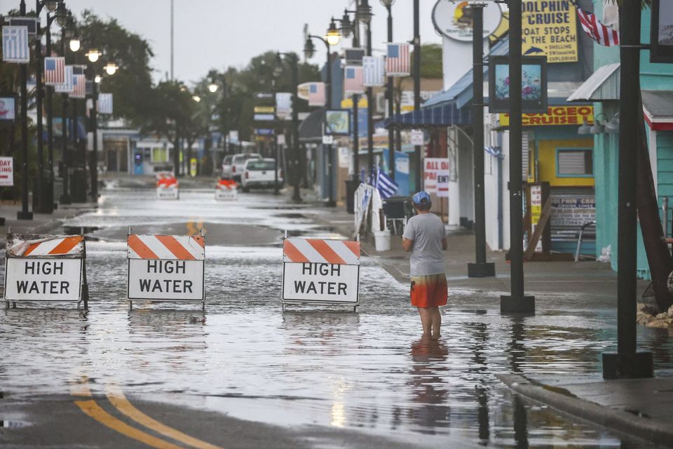 Flood water blocks a section of Dodecanese Blvd at the Tarpon Springs (Douglas R Clifford/Tampa Bay Times via AP)