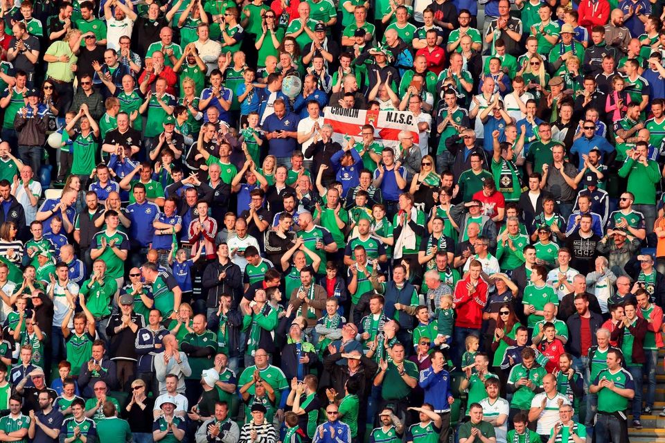 Northern Ireland's fans celebrate the second goal against Belarus during an international friendly football match between Northern Ireland and Belarus at Windsor Park in Belfast, Northern Ireland, on May 27, 2016. / AFP PHOTO / PAUL FAITHPAUL FAITH/AFP/Getty Images