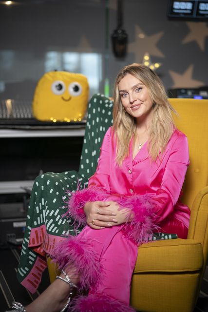 Perrie Edwards dons vibrant pink pyjamas with feather trim (BBC/PA)