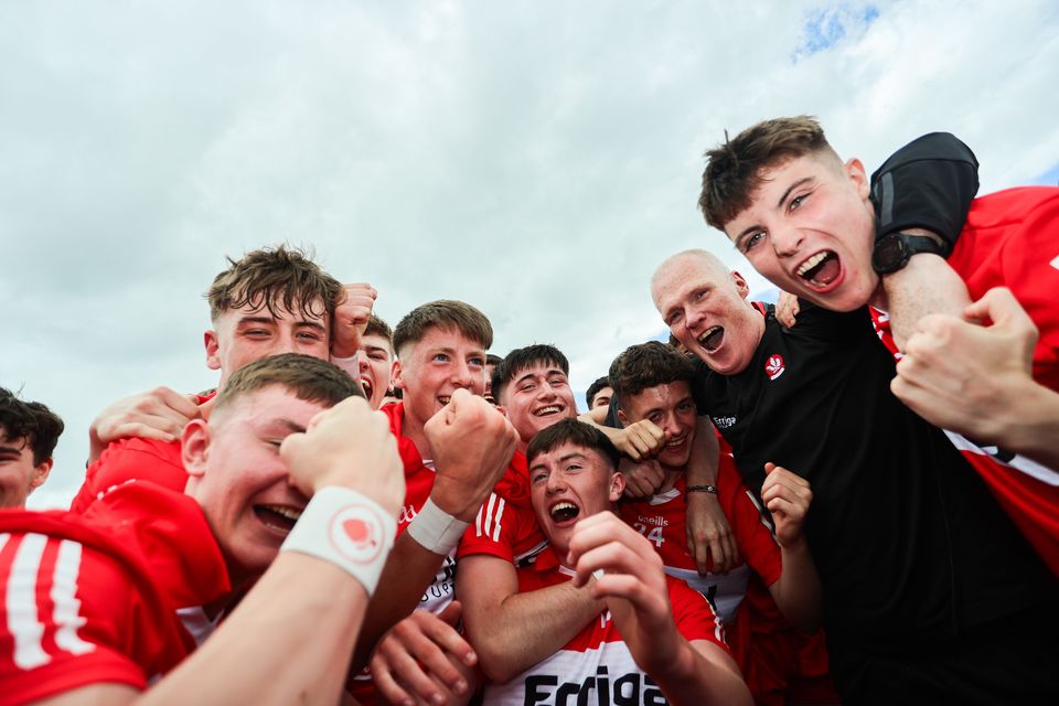 Derry celebrate with manager Damian McErlain after winning last year's All-Ireland Minor Championship Final