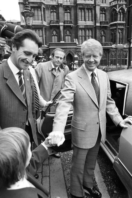 Sean Edlin, seven, gets a handshake from Jimmy Carter as he leaves a service at Westminster Abbey (PA)