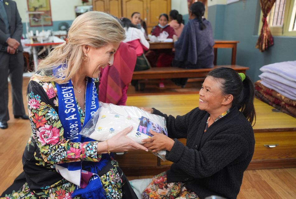 The Duchess of Edinburgh was presented with an embroidered cushion during her visit to the women’s shelter (Yui Mok/PA)