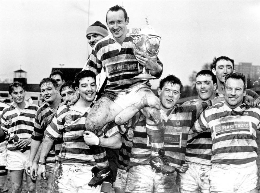 Dungannon captain Richie Weir holds aloft the Junior Cup after leading his side to a narrow victory over Banbridge at Ravenhill on New Year's Day