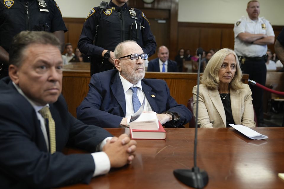 Harvey Weinstein, centre, appearing in criminal court in New York in September (Seth Wenig/AP)