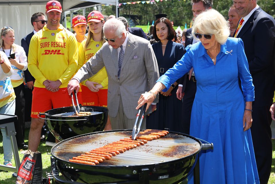 King Charles III and Queen Camilla at the Sydney ‘sausage sizzle’ (Toby Mellville/PA)