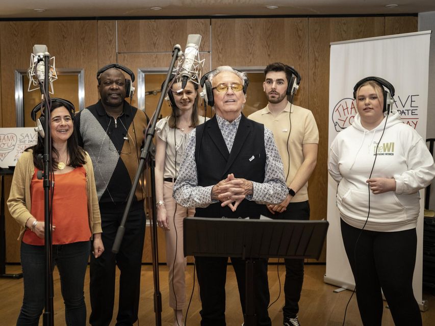 Tony Christie with, left to right, carers Zoe Antoniades, Gez Ossai, Therese Poteratchi, Graeme Sutherland and Katie Neal in the studio recording a version of Thank You For Being A Friend (John Dawson/PA)