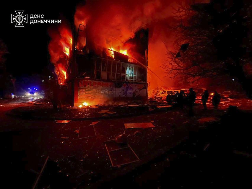 Firefighters put out the fire following a Russian rocket attack in Dobropillya, Donetsk region (Ukrainian Emergency Service via AP)