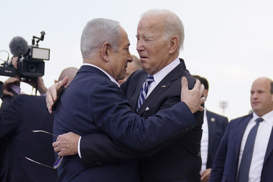 Joe Biden is greeted by Israeli Prime Minister Benjamin Netanyahu in 2023 (Evan Vucci/AP)