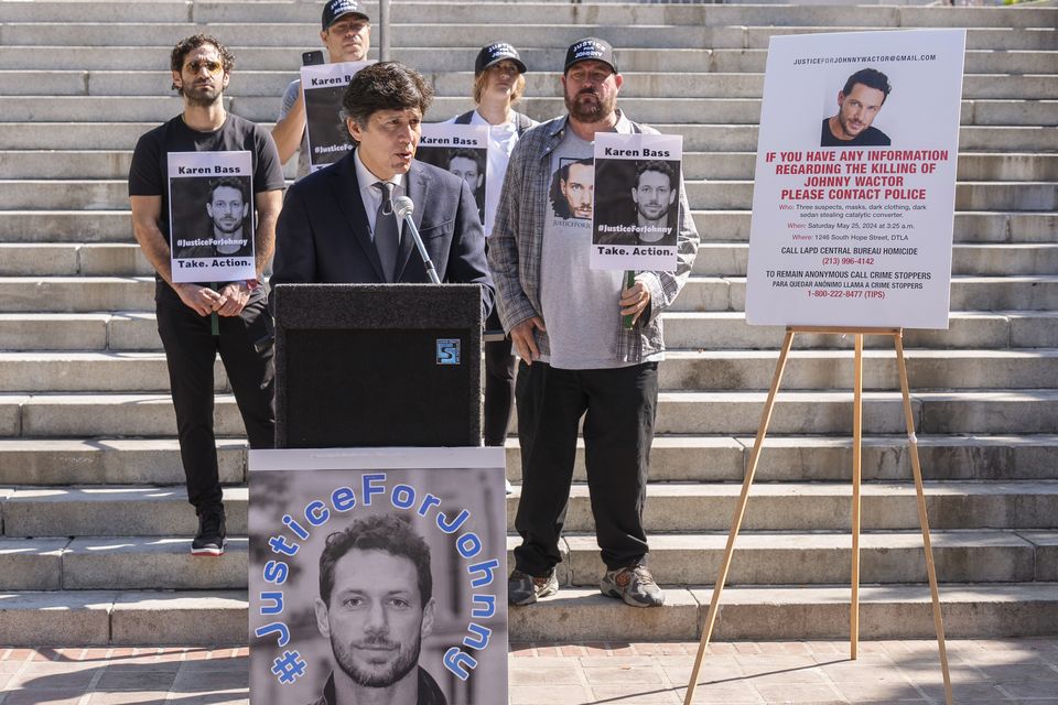 Los Angeles Council member Kevin de Leon, surrounded by friends of late actor Johnny Wactor, during a news conference outside Los Angeles City Hall (Damian Dovarganes/AP)