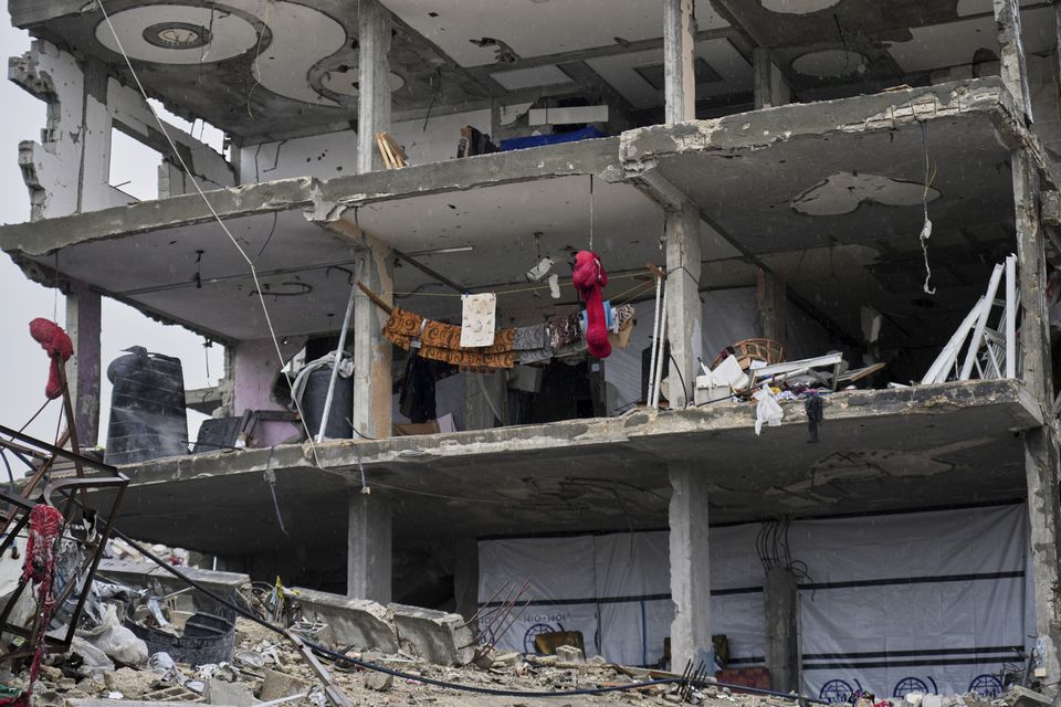 Laundry hangs on ropes strung across a wall-less apartment in Jabaliya (Abdel Kareem Hana/AP)