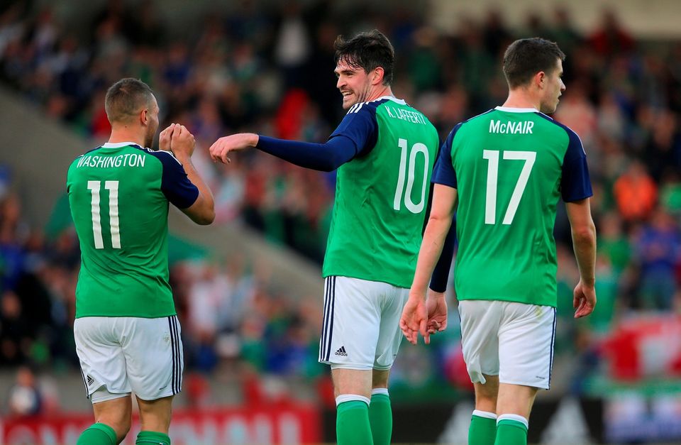 Northern Ireland's Conor Washington (left) celebrates with team-mate Kyle Lafferty (centre) after scoring his side's second goal during the International Friendly at Windsor Park, Belfast. PRESS ASSOCIATION Photo. Picture date: Friday May 27, 2016. See PA story SOCCER N Ireland. Photo credit should read: Niall Carson/PA Wire. RESTRICTIONS: Editorial use only, No commercial use without prior permission, please contact PA Images for further information: Tel: +44 (0) 115 8447447.