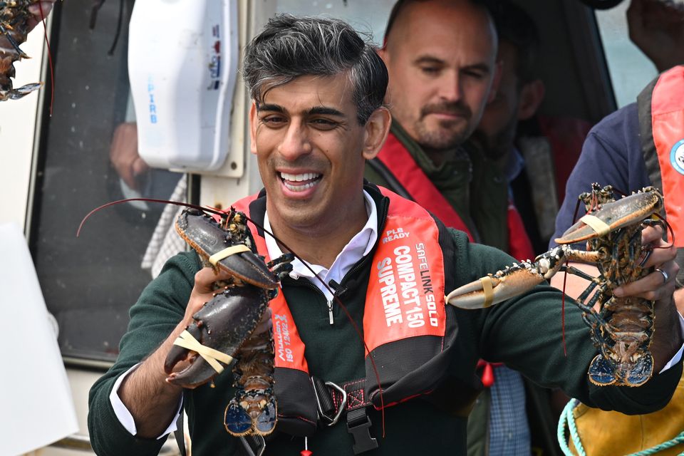 Rishi Sunak went fishing for votes during a visit to North Devon (Leon Neal/PA)