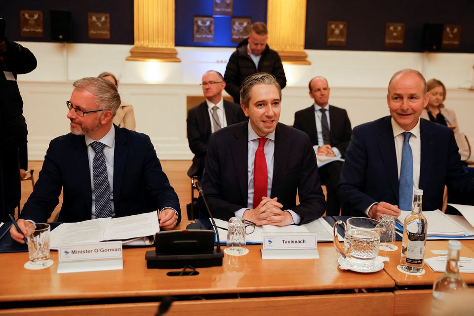 Green Party leader Roderic O’Gorman, Fine Gael leader Simon Harris, and Fianna Fail leader Micheal Martin (Clodagh Kilcoyne/PA)