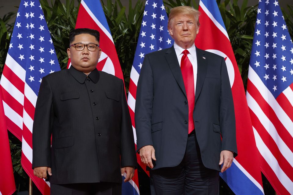 US President Donald Trump, right, meets with North Korean leader Kim Jong Un in 2018 (AP/Evan Vucci)