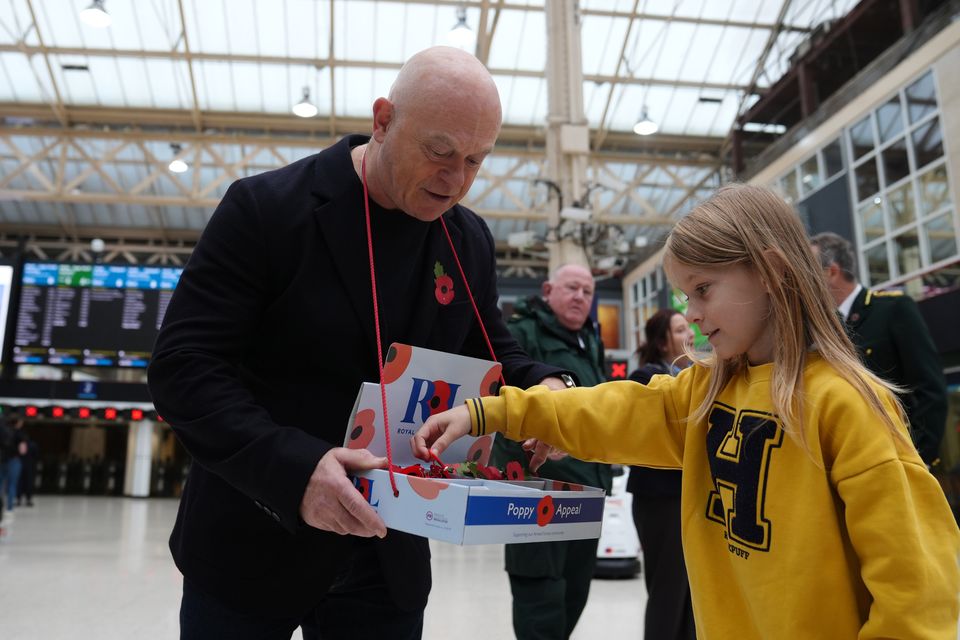 Ross Kemp selling poppies at Charing Cross Station (Ben Whitley/PA)