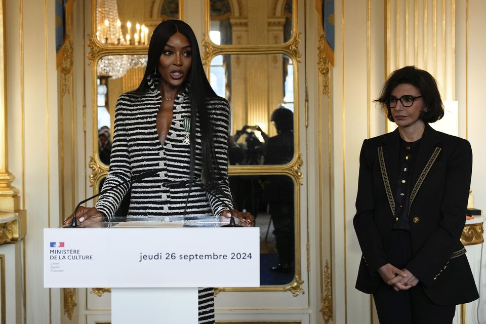 Naomi Campbell delivers a speech after being awarded with a medal by French culture minister Rachida Dati (Louise Delmotte/AP)