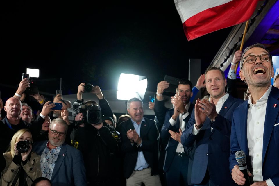 Herbert Kickl, leader of the Freedom Party of Austria celebrates with supporters, in Vienna (Andreea Alexandru/AP)