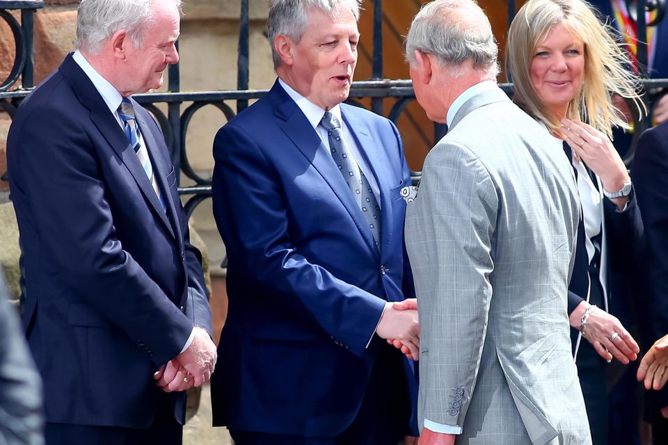 Prince Charles is greeted by Martin McGuinness and Peter Robinson at St Patrick's Church, Donegall Street, Belfast.