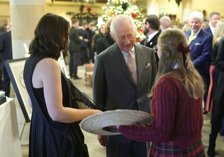 Charles speaks to millinery students from the King’s Foundation’s (Chris Jackson/PA)