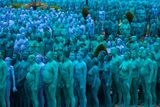 thumbnail: Naked volunteers, painted in blue to reflect the colours found in Marine paintings in Hull's Ferens Art Gallery, participate in US artist, Spencer Tunick's "Sea of Hull" installation in Queen's Gardens in Kingston upon Hull on July 9, 2016. AFP/Getty Images