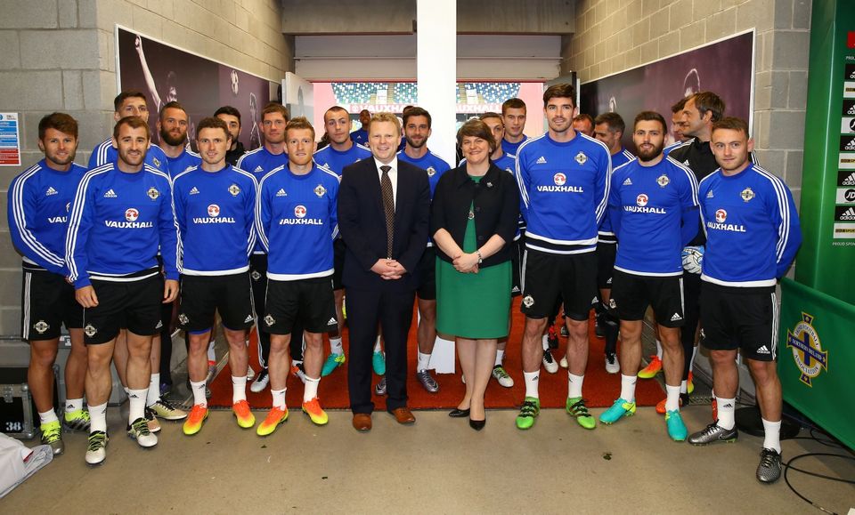 First Minister Arlene Foster and Junior Minister Alastair Ross dropped in on the Northern Ireland teams final training session for their match against Belarus at Windsor Park this afternoon. The First Minister posed for a team picture with Michael O'Neill's squad and passed on her best wishes for this summer's Euro 2016 tournament, before they head off to Austria for a week-long training camp next week. Photo By William Cherry / Press Eye.