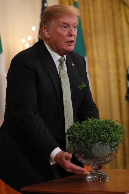 US President Donald Trump with a bowl of shamrock in 2019 (Brian Lawless/PA)