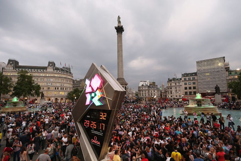 LONDON, ENGLAND - JULY 27:  People celebrate the openning of the London 2012 Olympic Games at Trafalgar Square on July 27, 2012 in London, England.  (Photo by Feng Li/Getty Images)