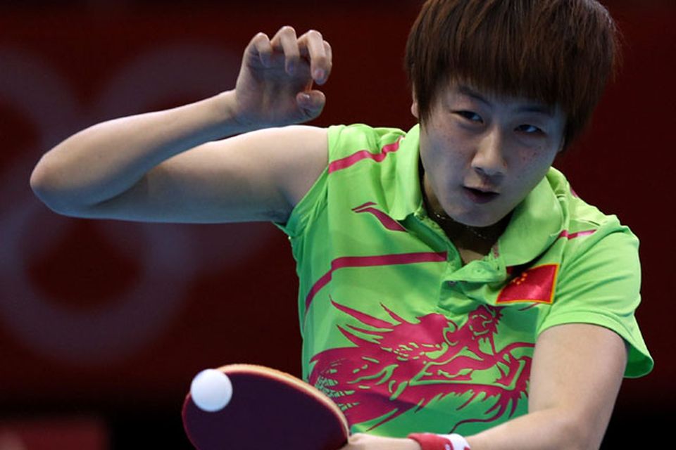 LONDON, ENGLAND - JULY 30:  Ning Ding of China returns the ball during her Women's Singles Table Tennis fourth round match against Huajun Jiang of Hong Kong, China on Day 3 of the London 2012 Olympic Games at ExCeL on July 30, 2012 in London, England.  (Photo by Feng Li/Getty Images)
