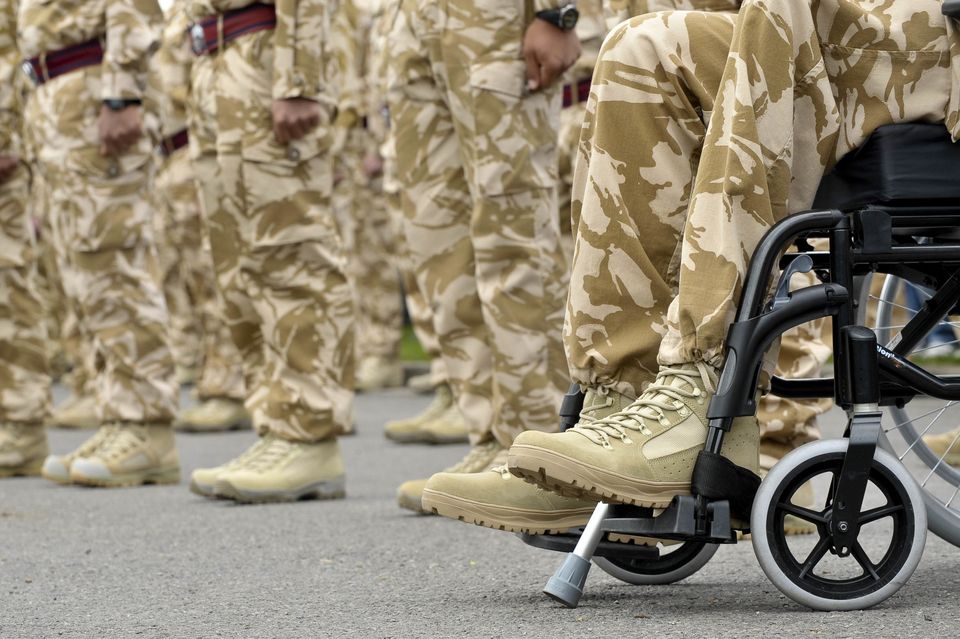 An injured soldier in a wheelchair at the medal parade outside Didcot Civic Centre after a march through the streets of Didcot, Oxfordshire, where thousands of people turned out to support the soldiers.