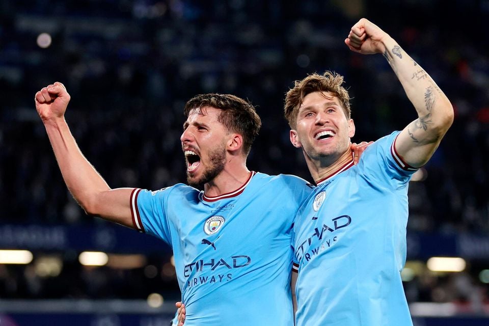 Inter Milan's Alessandro Bastoni, left, heads the ball past Manchester  City's Erling Haaland during the Champions League final soccer match  between Manchester City and Inter Milan at the Ataturk Olympic Stadium in