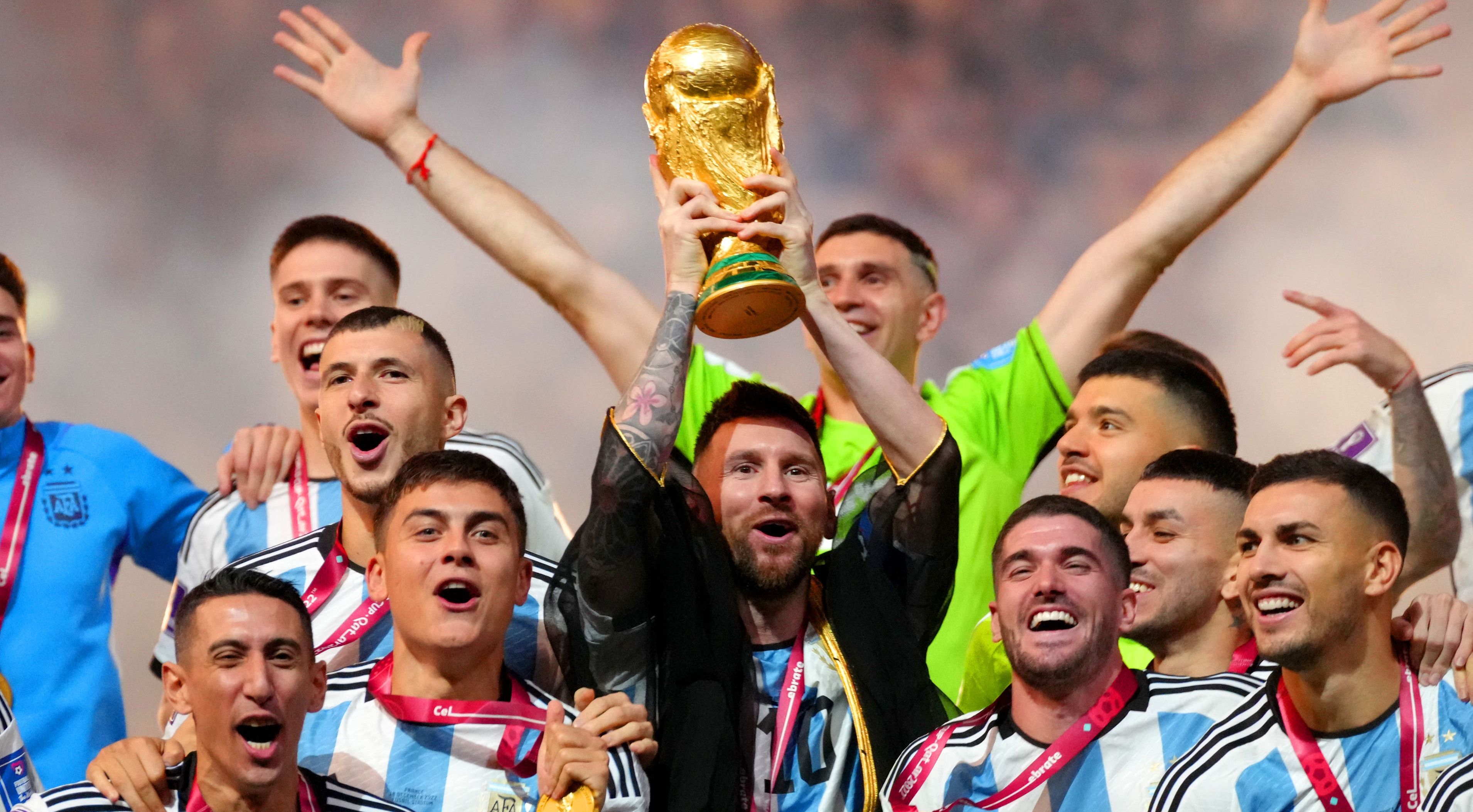 What was Lionel Messi wearing during World Cup trophy lift? - The