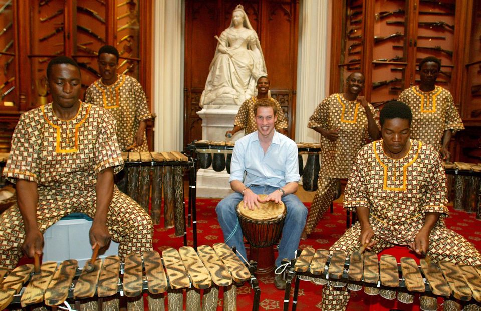 William plays the drums with the Shakarimba band from Botswana ahead of his 21st birthday in 2003 (PA)