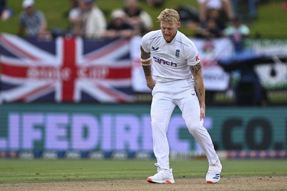 England captain Ben Stokes grabs at his leg while bowling (Andrew Cornaga/Photosport/AP)