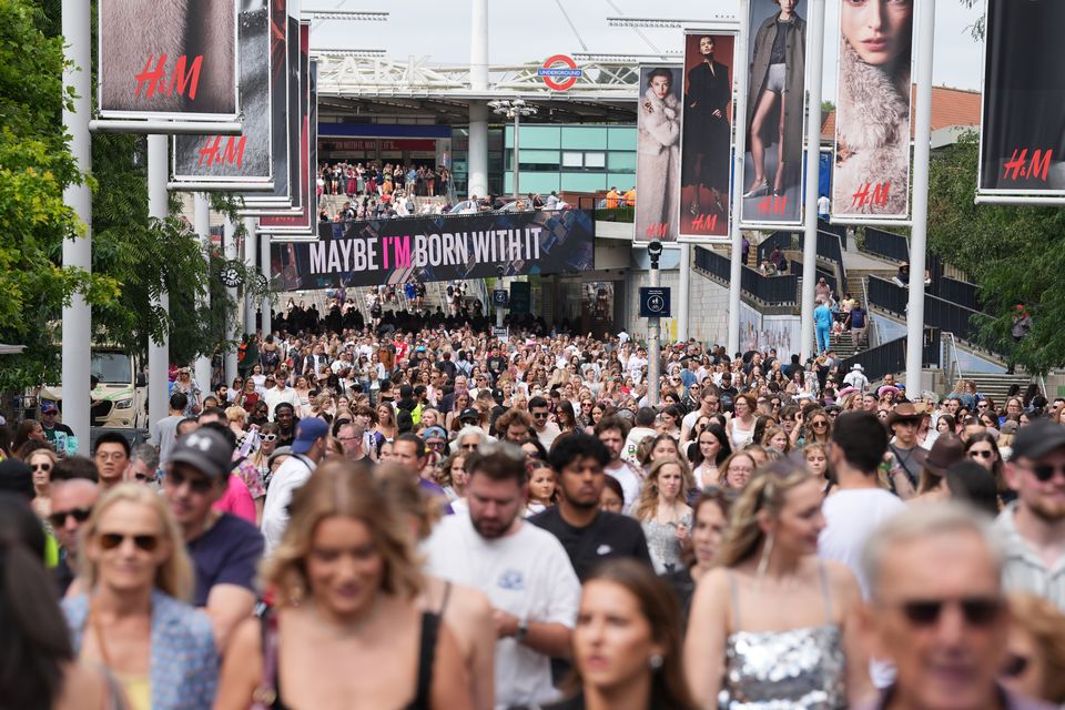 Fans gather outside Wembley Stadium in north west London, ahead of Taylor Swift’s latest Eras Tour concert (Lucy North/PA)