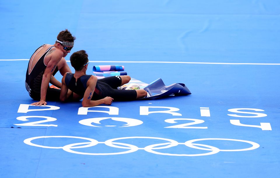 Great Britain’s Alex Yee with New Zealand’s Hayden Wilde following the men’s individual triathlon (David Davies/PA)