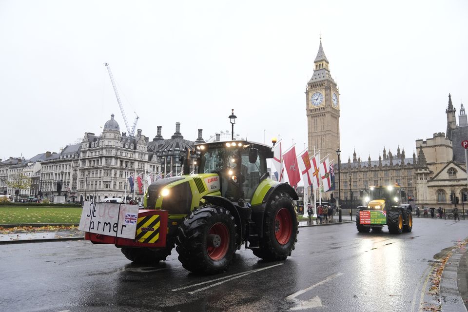 Farmers in tractors drove in Parliament Square, London, ahead of a protest on Tuesday over changes to inheritance tax rules  (Andrew Matthews/PA)